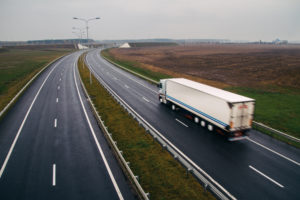 Semi Truck Fleet Vehicle on a Rainy Highway | Fuelz